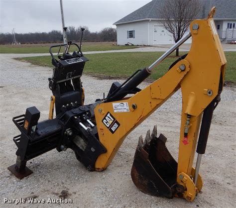 caterpillar skid steer backhoe|peterson cat skid steer attachment.